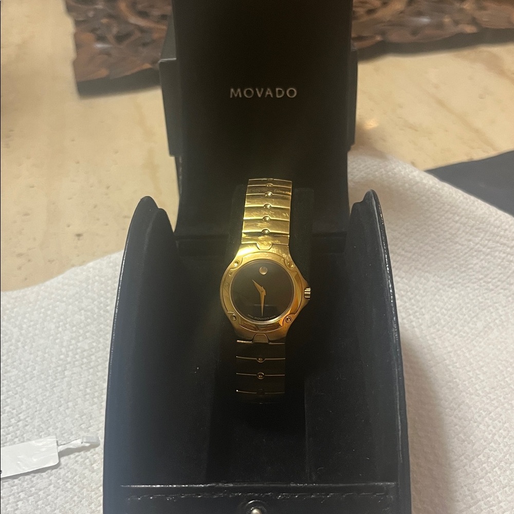 Movado Luxurious Gold and Black Women’s Watch.